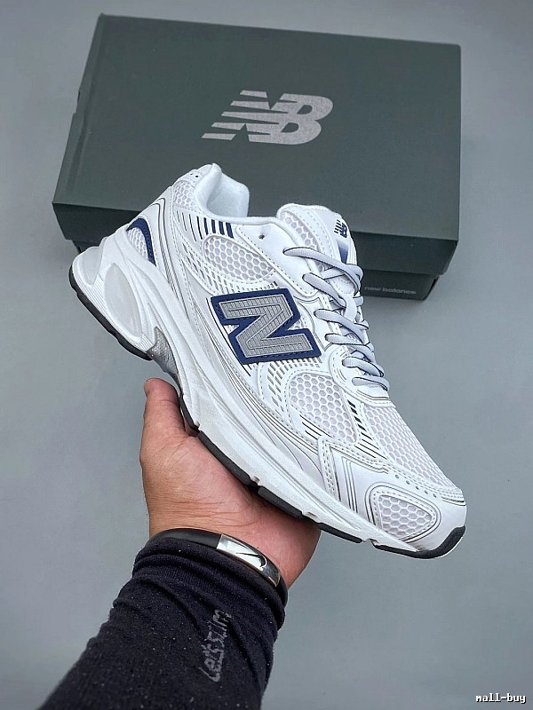 New Balance White and Navy Running Shoes Defined by Classic Running Profile