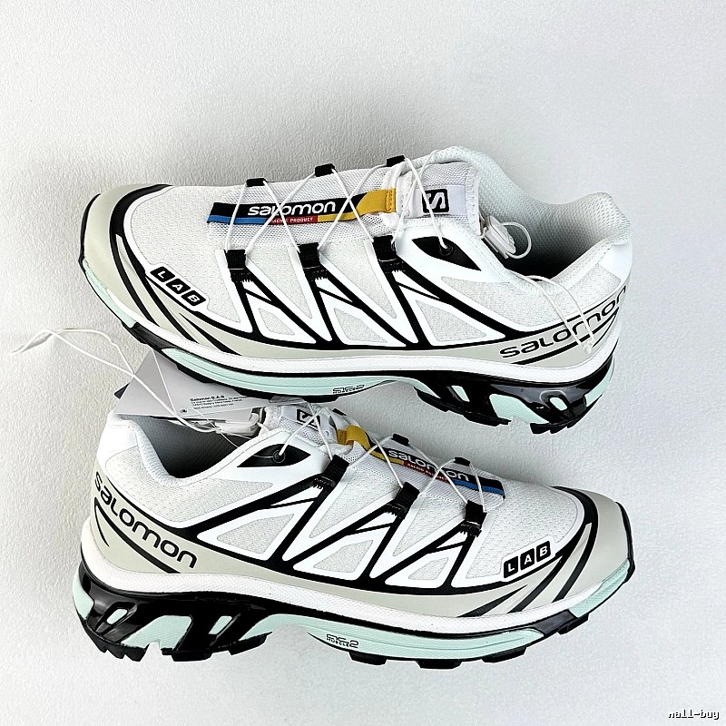 Salomon White and Black Trail Sneakers Highlighting Treaded Trail Sole